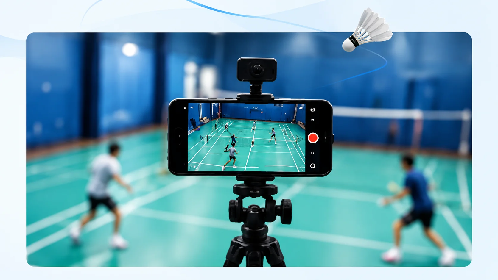 A smartphone on a tripod records a badminton match from behind the court